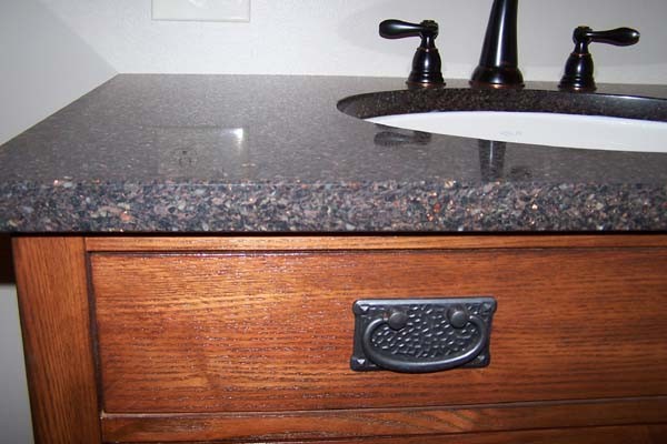 copper flecked granite counter on vanity