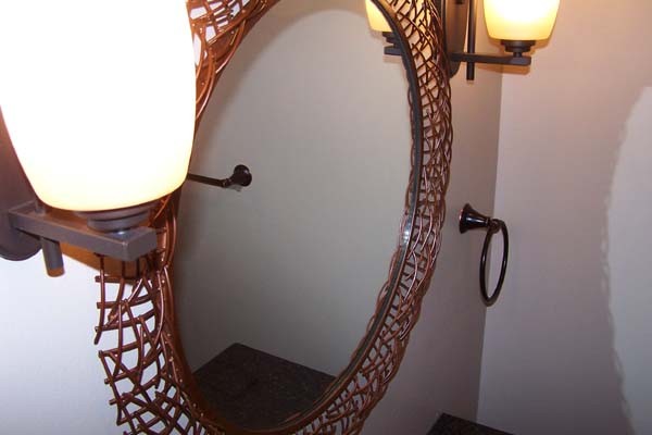 copper frame on round mirror