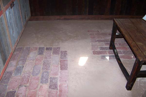 inlaid brick in earthen floor