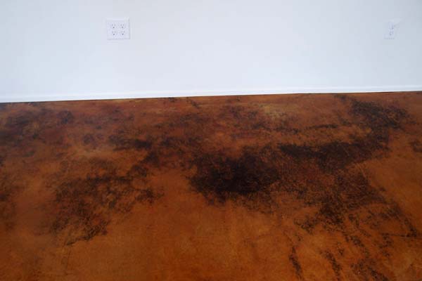 acid stained cement floor deep copper tones