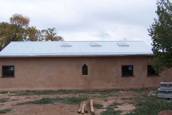 Rastra block building with completed metal roof