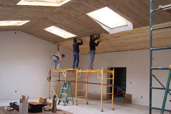 rough sawn pine ceiling being applied