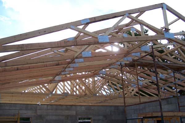 rastra block roof trusses being raised