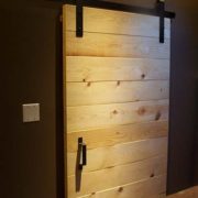 simple pine barn door with black hardware