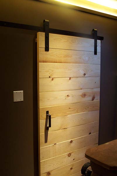 simple pine barn door with black hardware