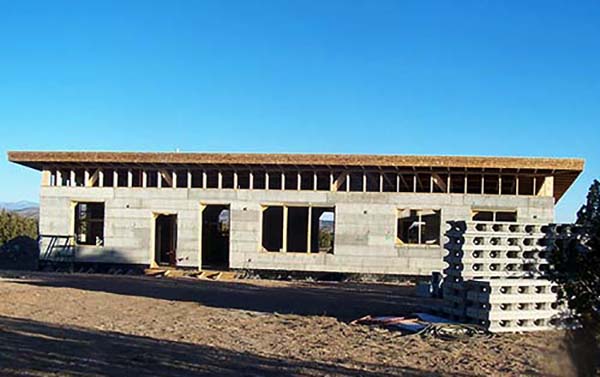 walls raised, roof framing begins