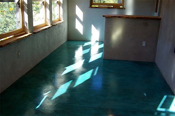turquoise acid stained cement floor