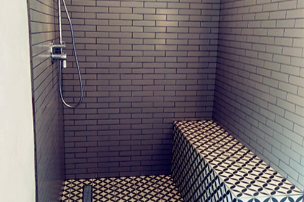 metro tiles in walk-in shower
